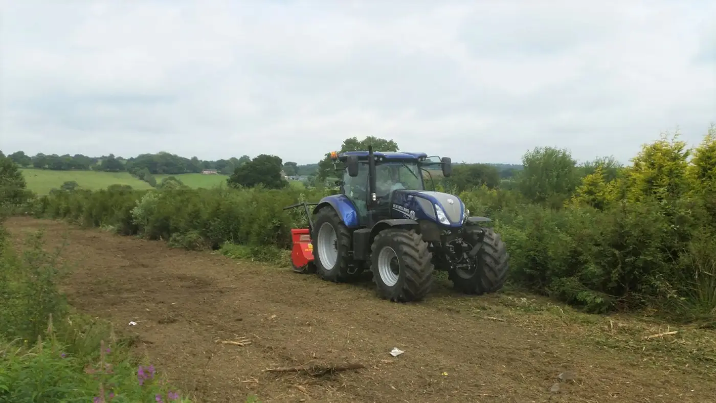 New Holland tractor undertaking vegetation clearance